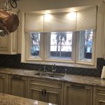 Roller shades above a kitchen sink