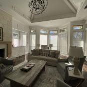 Nantucket shades are very versatile; they open to sheer blinds, then close to either blackout or light filtering shades. You can also raise them to the top for full view.
We have motorized these particular shades with a pebble remote control, or your phone. Nantucket shades in a living room